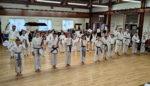 Students receiving new belts and certificates